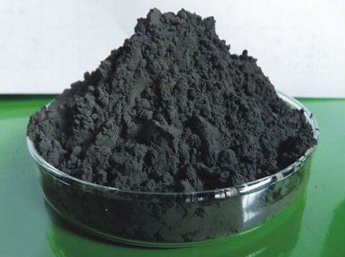 XT unsupported catalyst powder in a glass dish